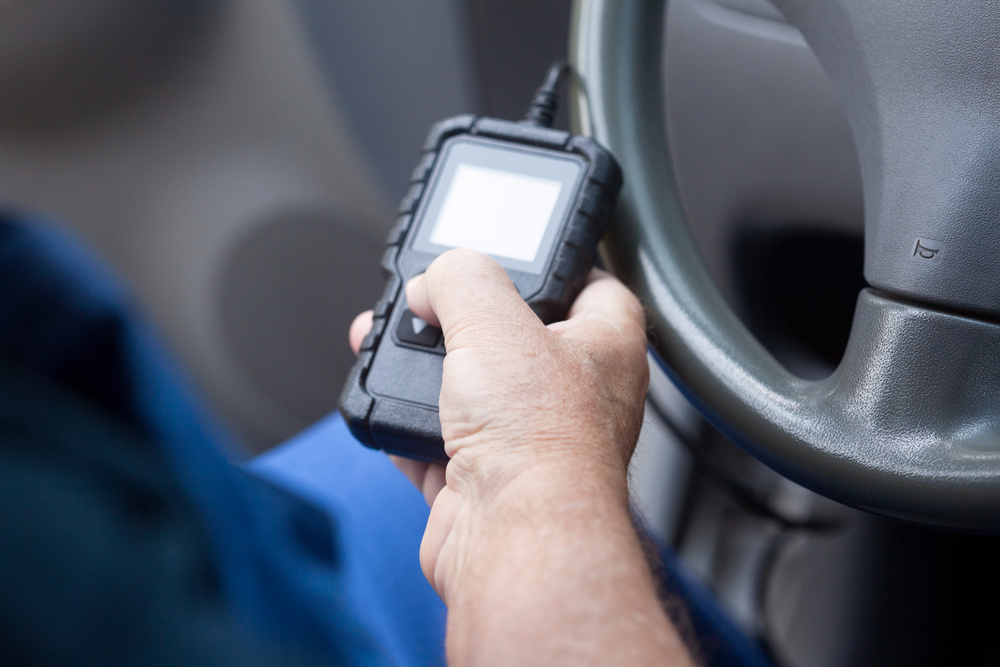 Man using car diagnostic scan tool